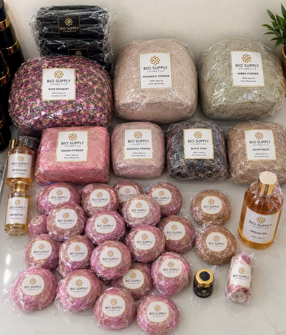 Supplied wholesale collection showing assorted packaged powders, jars and bottles